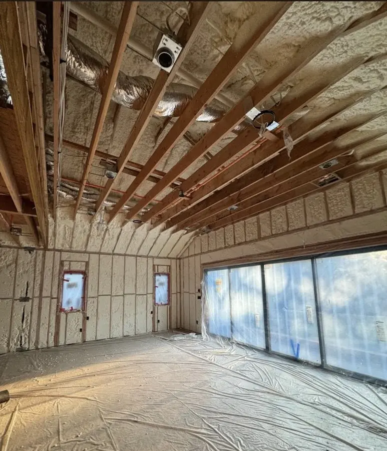 Interior walls and ceiling insulated with spray foam during new construction in South Patrick Shores